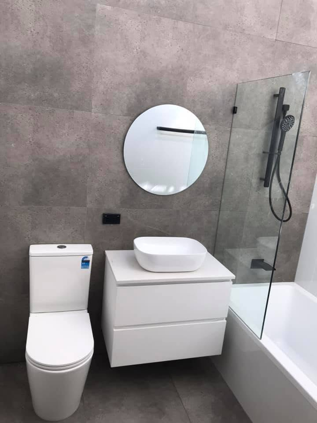 Finished bathroom — vanity and shower screen