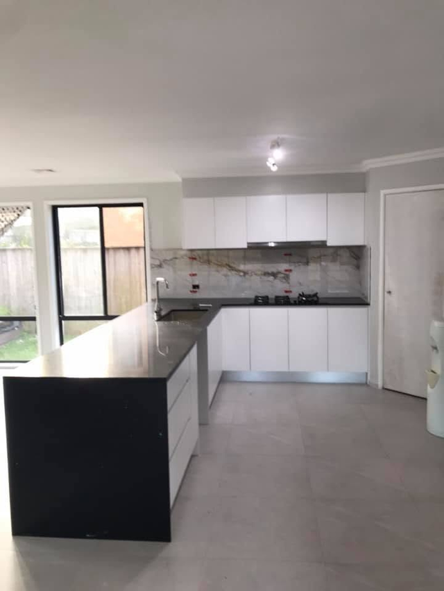 Kitchen renovation — finished, stone benchtop and splashback