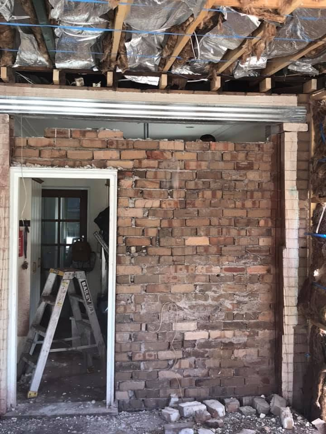 Whole-home renovation — brick wall opened up