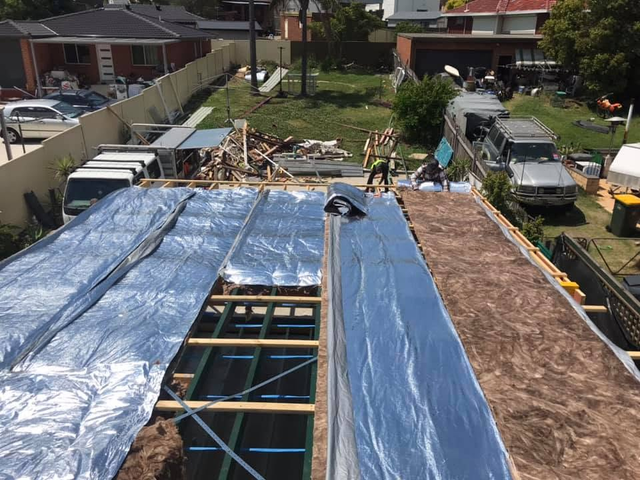 Whole-home renovation — roof and insulation, aerial view